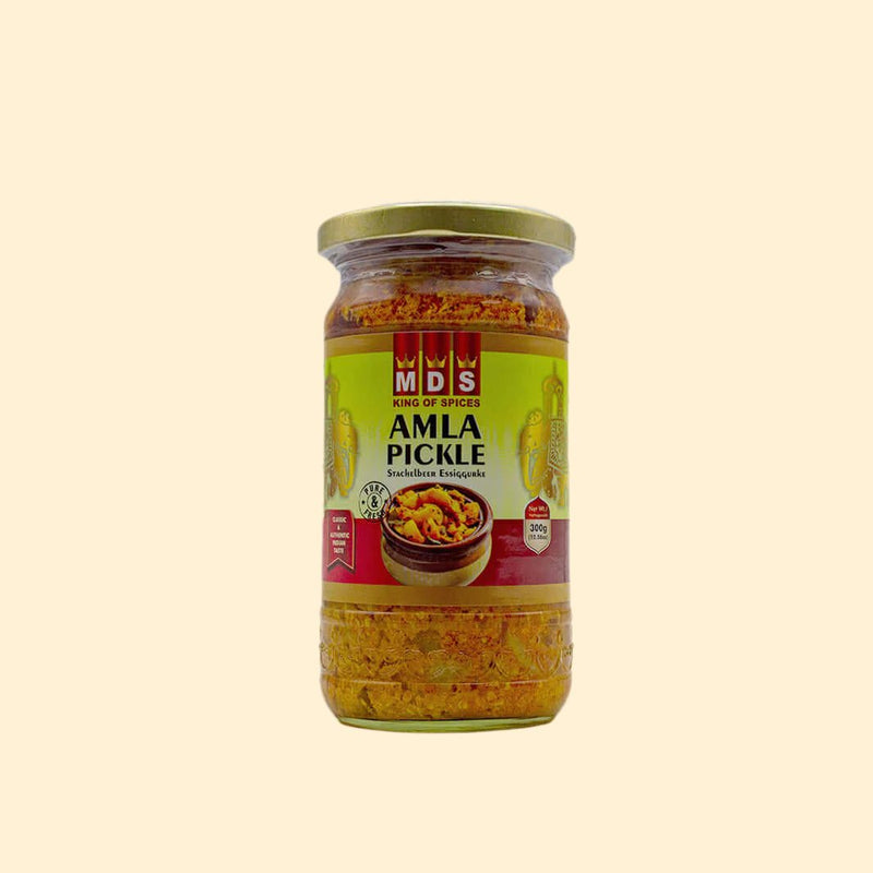 Add some zest to your meals with MDS Amla Pickle - 300g. This zesty pickle is made with freshly-picked amla (Indian gooseberries), giving you a true Indian taste. Enjoy the tangy and sweet flavors of this pickle, perfect for spicing up just about any dish.