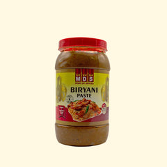 MDS Biryani Paste - 300g is a convenient way to make delicious biryani. Featuring real spices and herbs, this paste is a ready-made blend that makes it easy to prepare a traditional, aromatic biryani. With an easy-to-follow recipe provided, you'll be cooking up a delicious dish that the whole family can enjoy in no time.