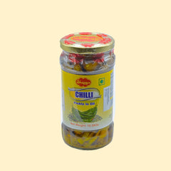 Shezan's Chilli Pickle in Oil is made with the finest ingredients, giving it a bold, spicy flavor. Packed in a 1 kg jar, this pickle is perfect for all your cooking needs.