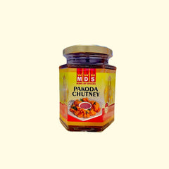 MDS Pakoda Chutney is an authentic Indian condiment made with fresh crunchy vegetables like onions, potatoes, and lentils. This flavorful dip is perfect for serving with all kinds of pakodas, vadas, or sandwiches. It's rich in nutrients and seasoned with traditional Indian spices, making it a great accompaniment to any meal.