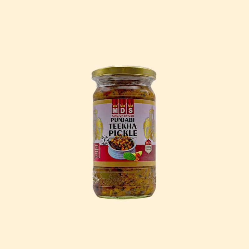 Experience the intense flavour of the MDS Punjabi Teekha Pickle - 300g. This pickle is made with authentic Indian spices and is packed with flavour. Enjoy the intense heat that comes with every bite. Spice up any dish with the MDS Punjabi Teekha Pickle today.